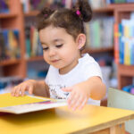 Toddler Girl at learning table