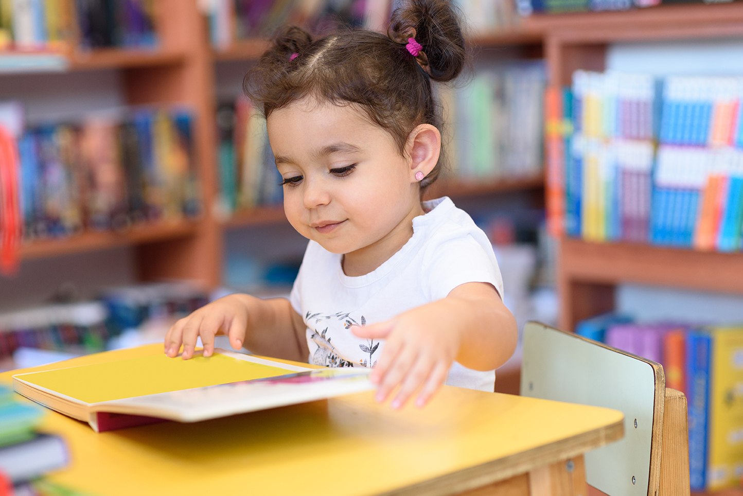 Toddler Girl at learning table